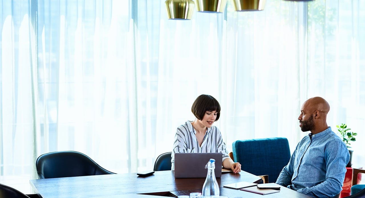 female sales manager addressing a male sales reps individual needs after learning a framework for addressing the different members of her sales team differently.