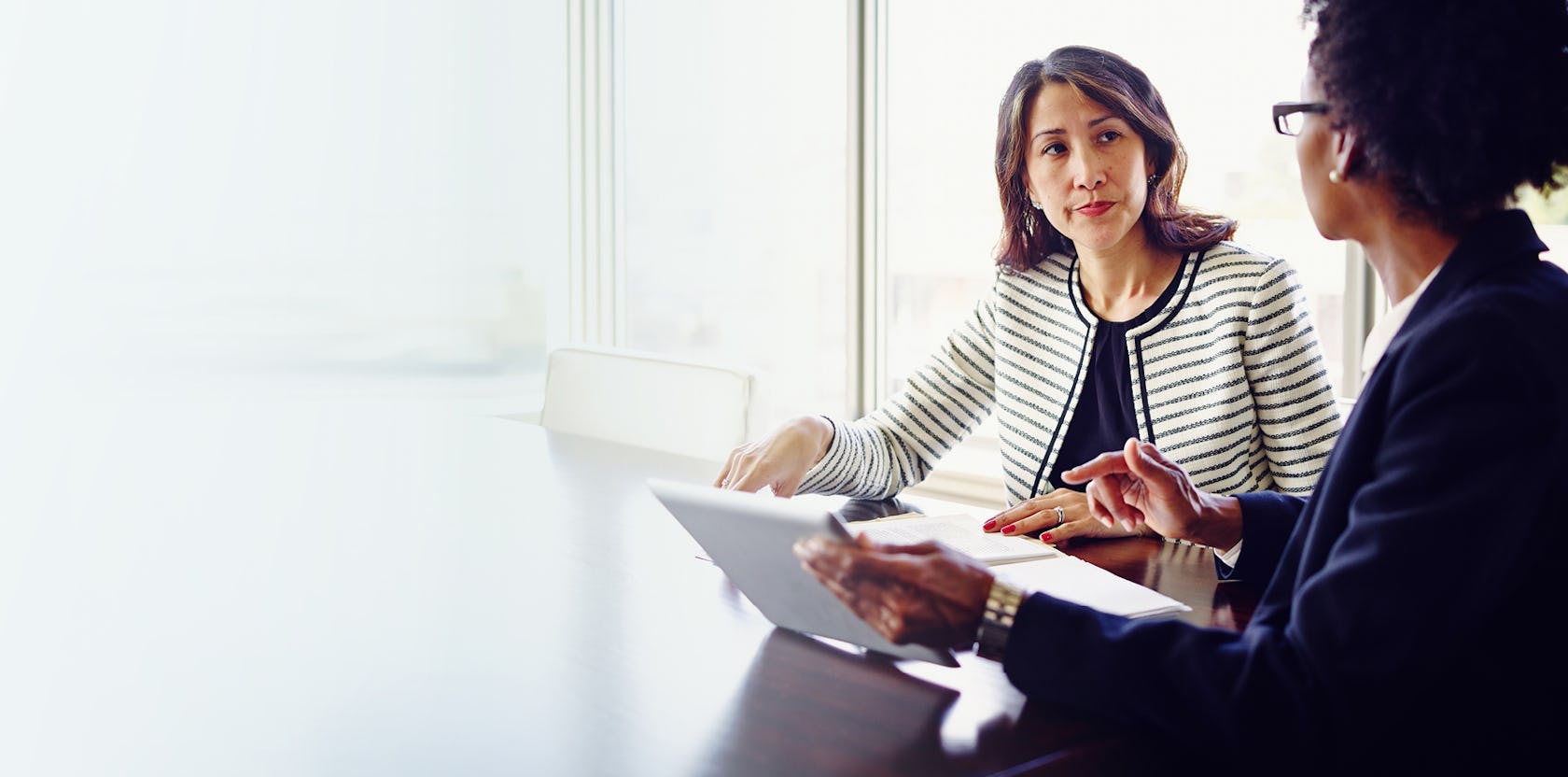 female sales manager addressing a female sales reps individual needs after learning a framework for addressing the different members of her sales team differently.