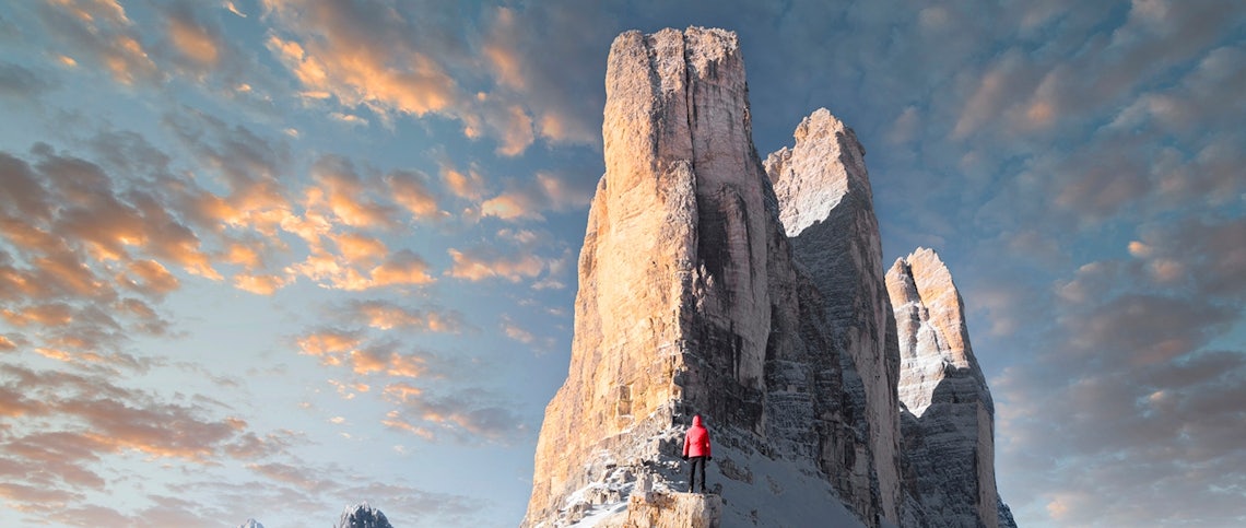 salesperson facing a large mountain face