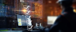 blurry image of a business man sitting at a lap top with prominent checklist overlay to represent the steps to creating a sales funnel