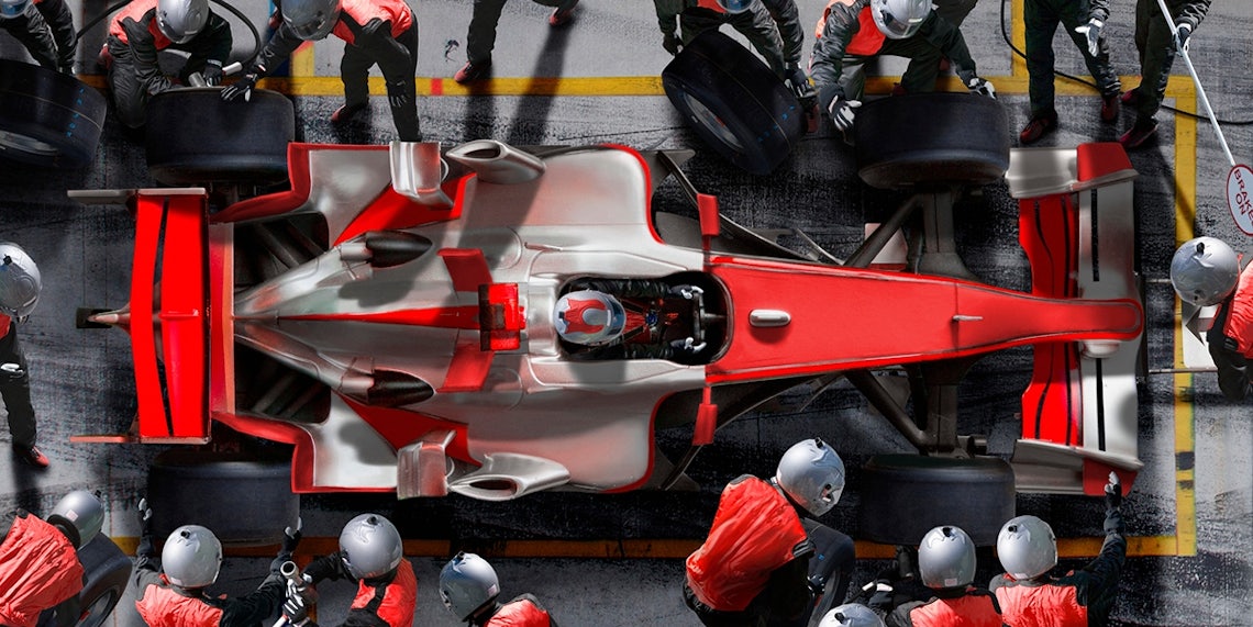 a formula one race car team working in the pit as a metaphor for a sales team delivering high performance outcomes