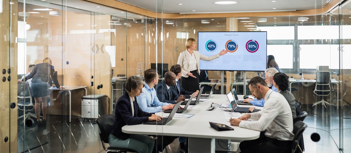 revenue operations leader in a meeting with a cross functional team discussing revenue operations strategy