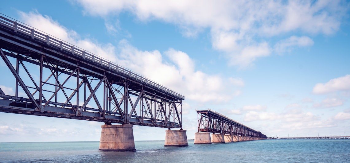 banner with the webinar title and a broken bridge in the background showing how revtech and sales training bridge gaps in sales performance