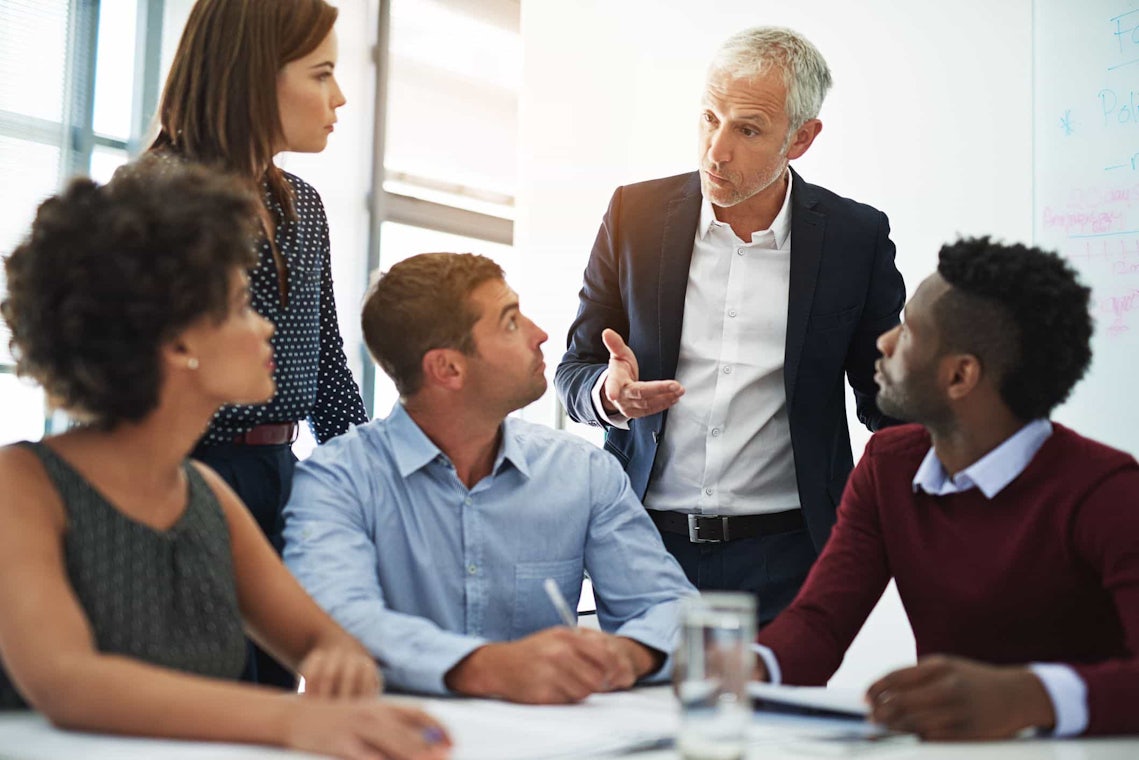 c level executive in sales meeting