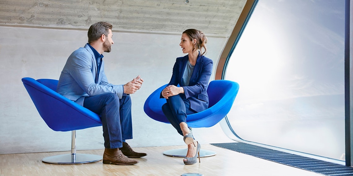 A professional meeting between man and woman demonstrates the focus required to execute a customer-first sales strategy.